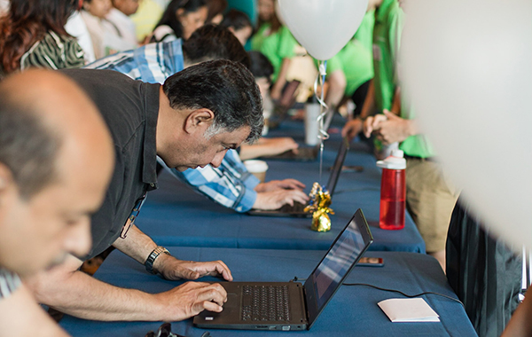 Parents registering at computer